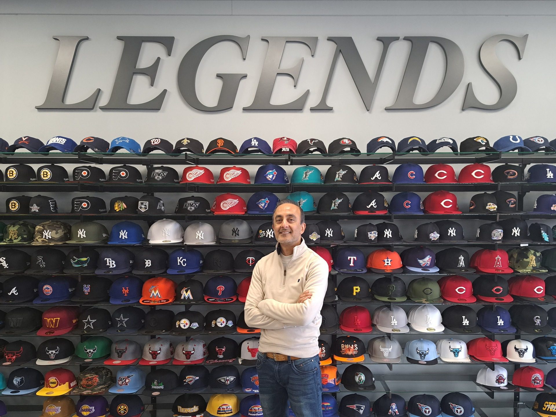 Jes At Store legends shop fornt view men on front of the hats